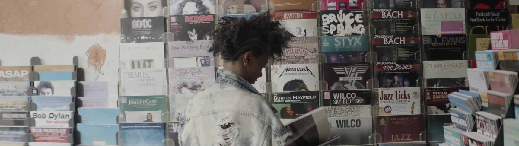 Woman reads a book in a music store