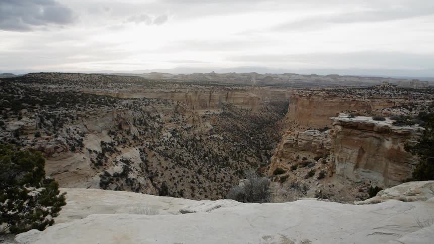 Clouds float above a desert canyon