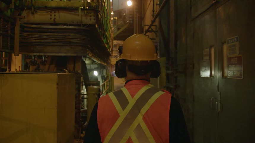 A worker walks on a work site