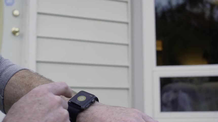 Man scrolls through smartwatch