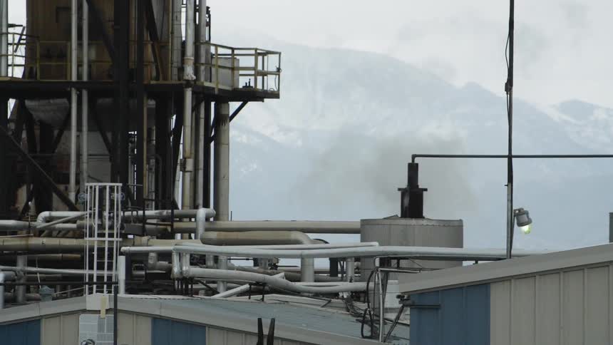 An industrial building outside in the mountains