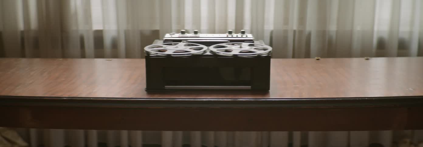The reels on a reel to reel tape recorder turn