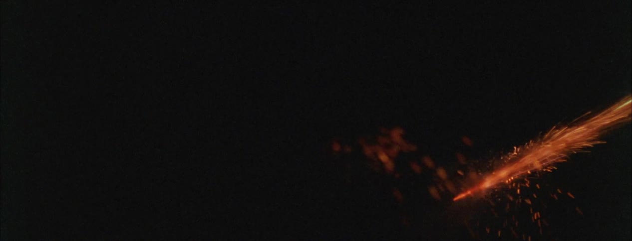 People hold sparklers at night