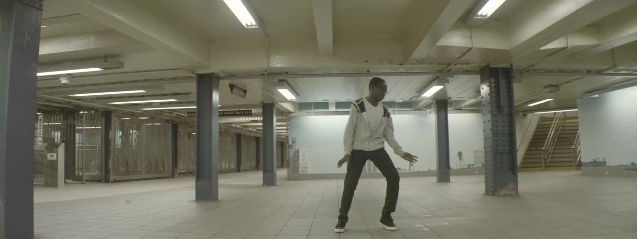 Boy dancing inside of a subway