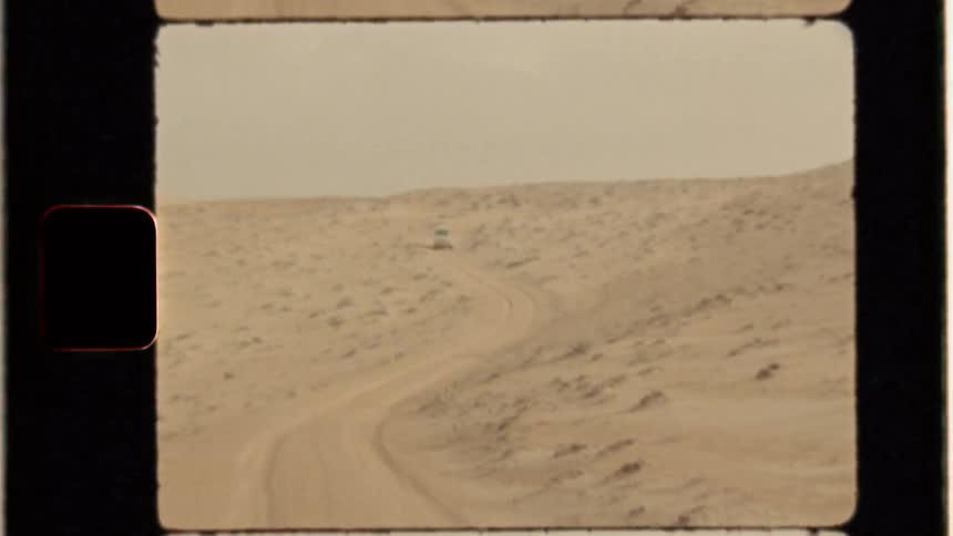 Small dirt path winding through a desert