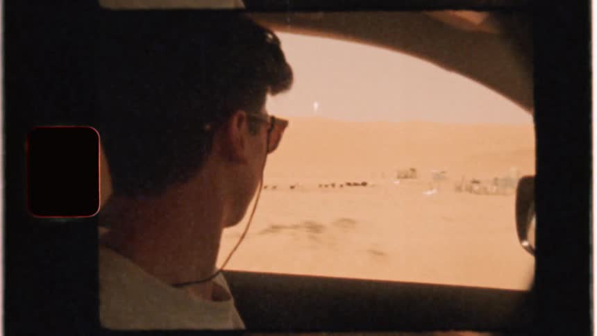 Man drives through a desert