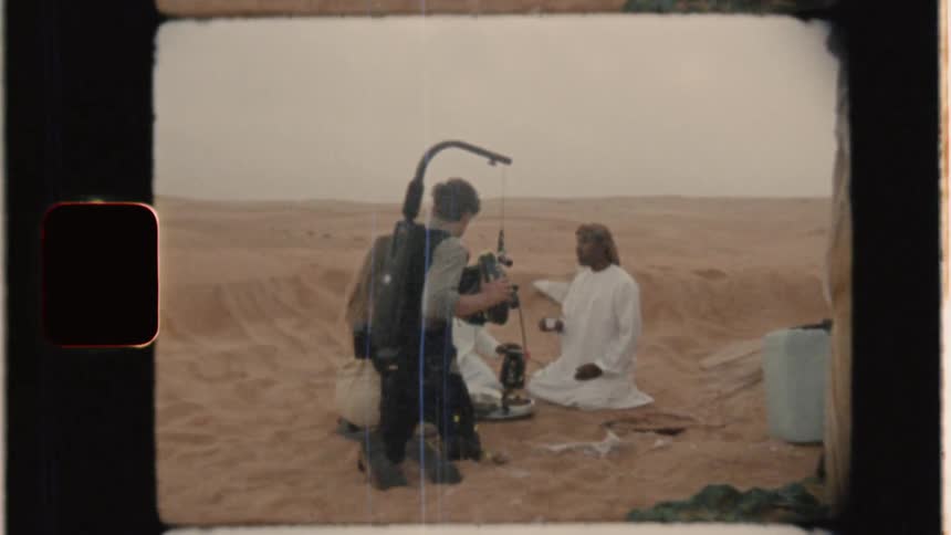Man records people sitting in the desert