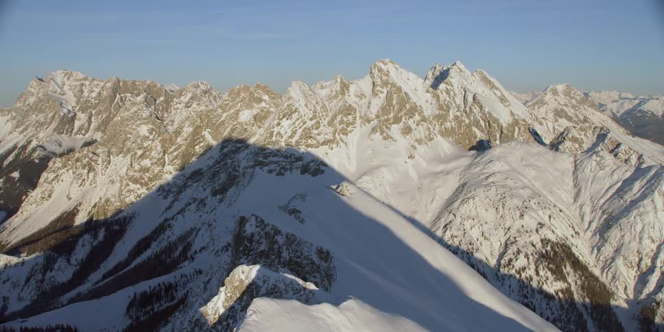 Snow covers mountain peaks and ridges