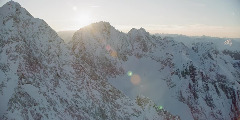 Snow covers the mountainous landscape