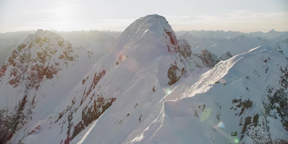 Snow covers the mountainous landscape