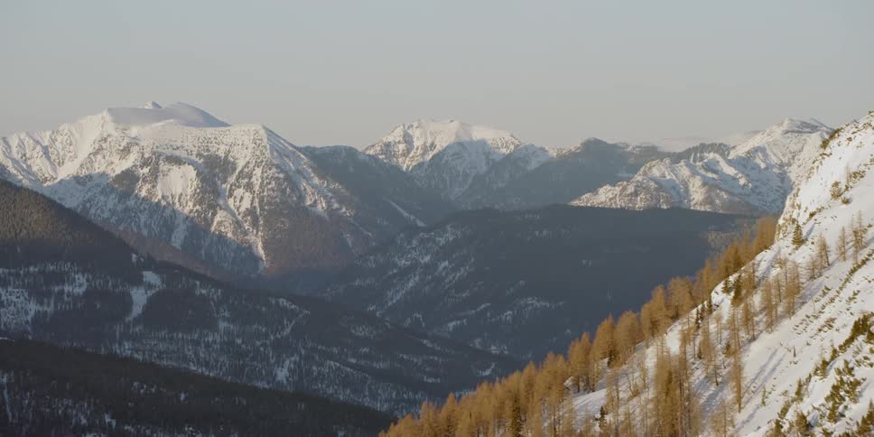 Snow covers the mountainous landscape