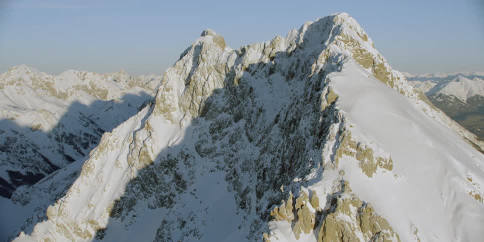 Snow covers the mountain