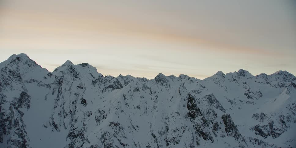 Snow covers the mountain tops