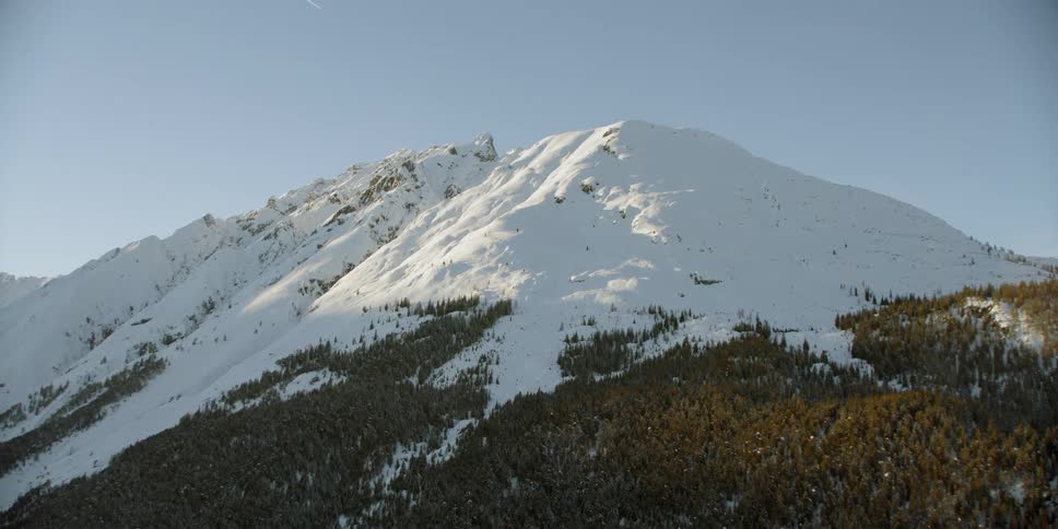 Snow covers a mountain peak