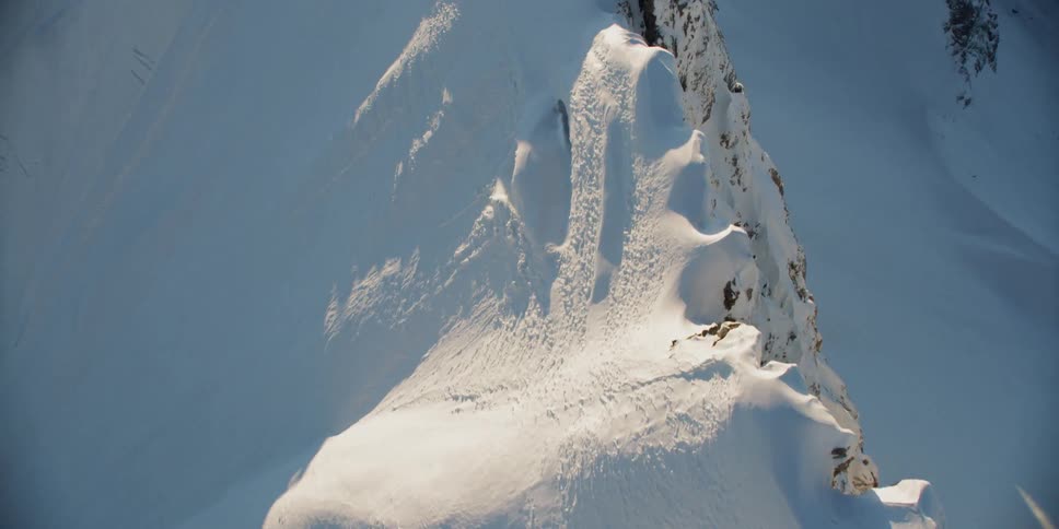 Snow covers the mountainous landscape