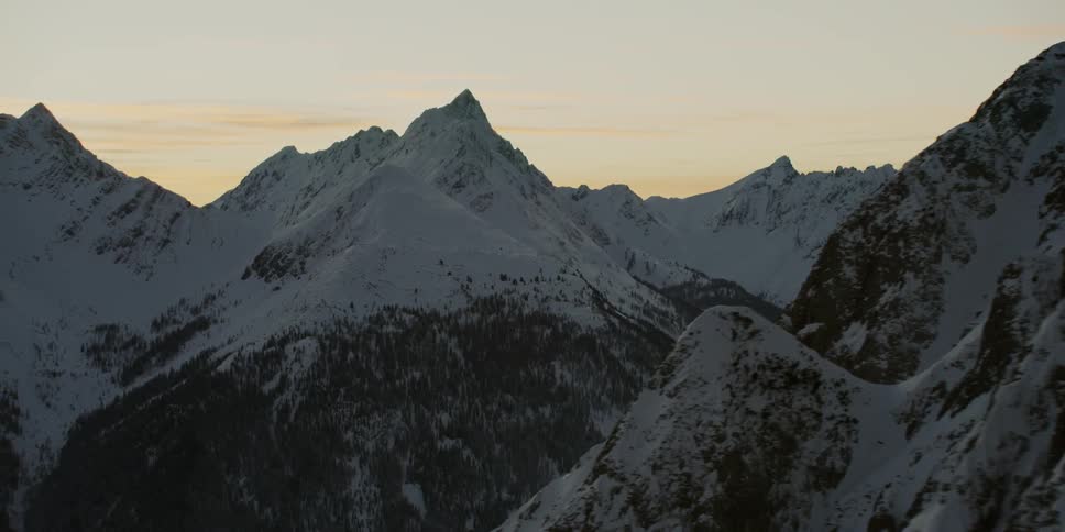 Snow covered peaks at sunset