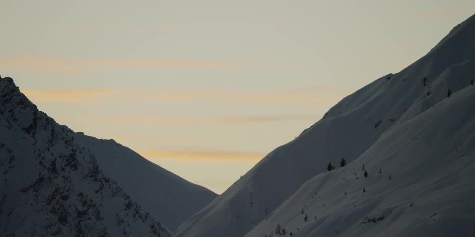 Snow covers the mountain landscape