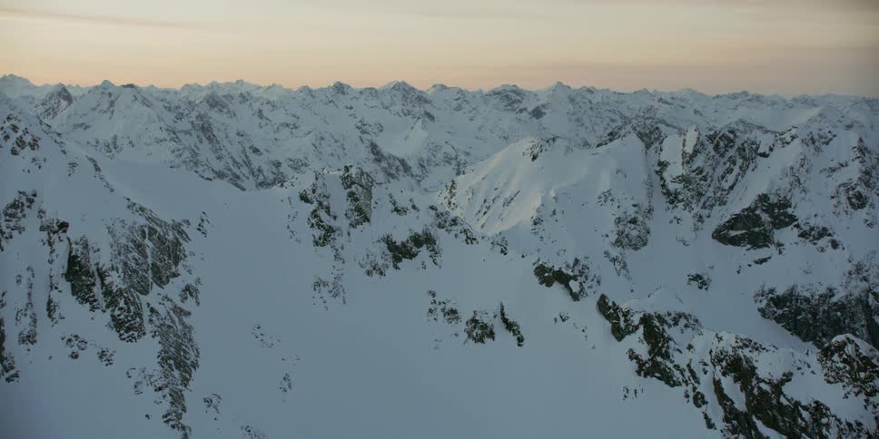 Snow covers the mountainous landscape