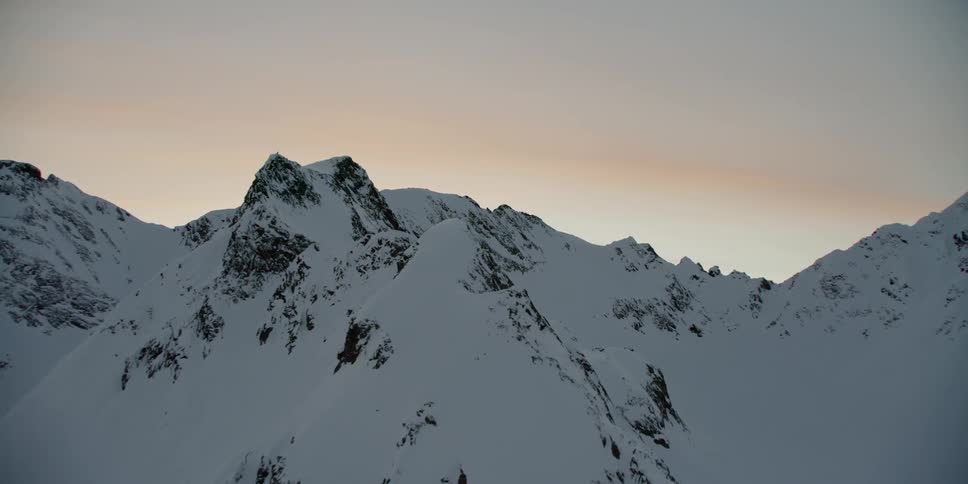 Snow covers the mountain landscape