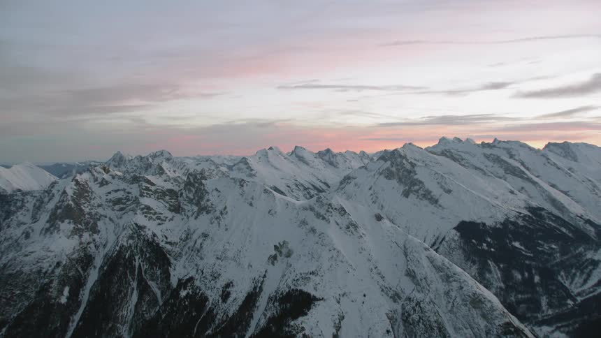 Snow covers the mountainous landscape