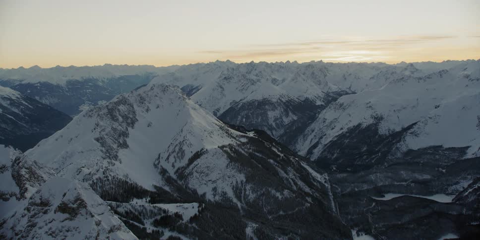 Snow covered peaks and ridges at sunrise