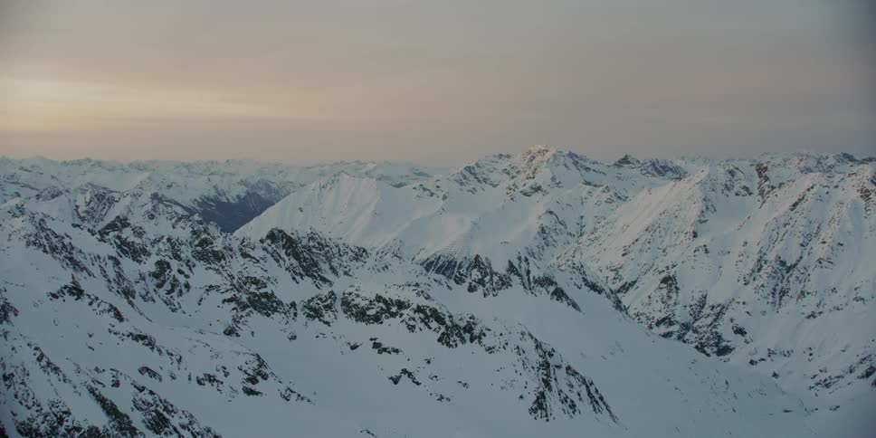 Snow covers the mountainous landscape