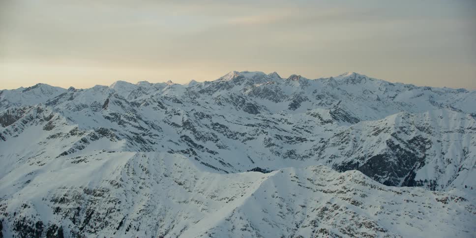 Snow covers the mountainous landscape