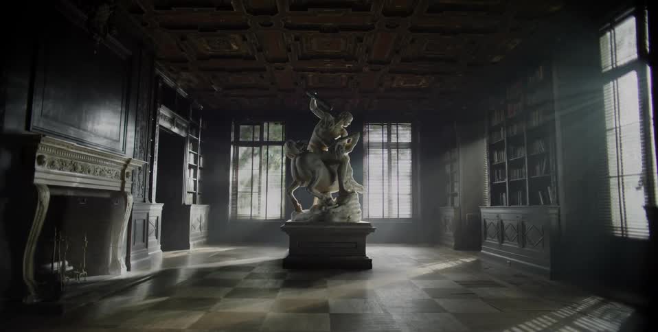 A statue stands in an empty room