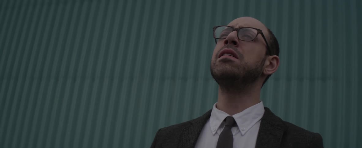 Distraught looking man looks upwards
