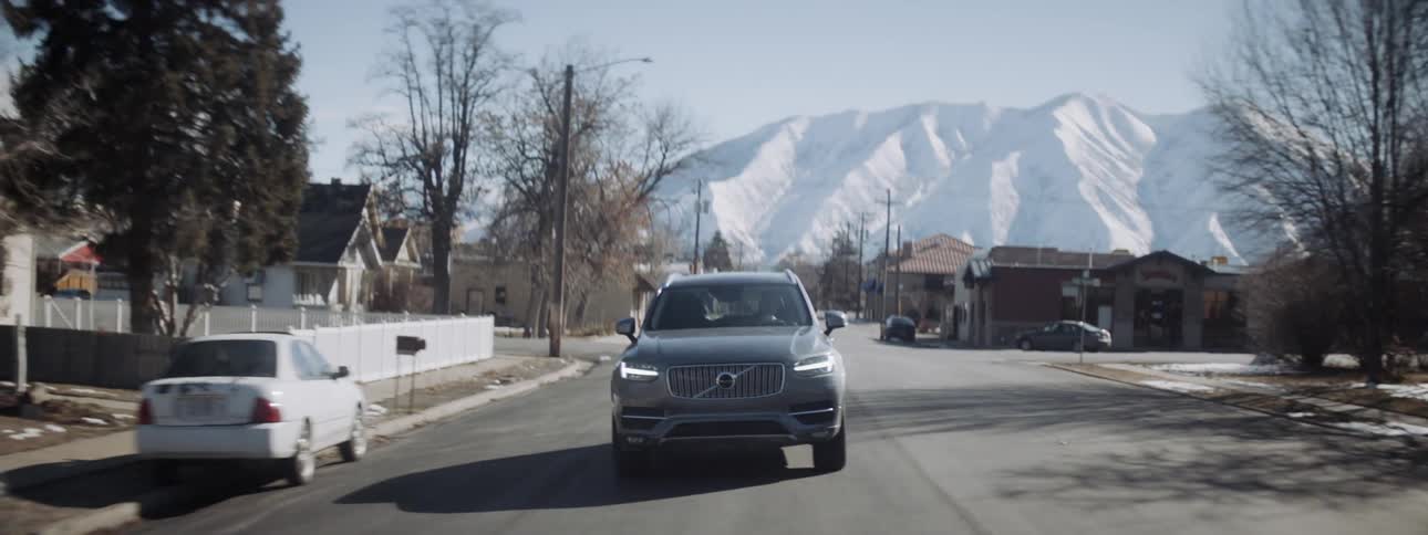 An suv is driven on a town road