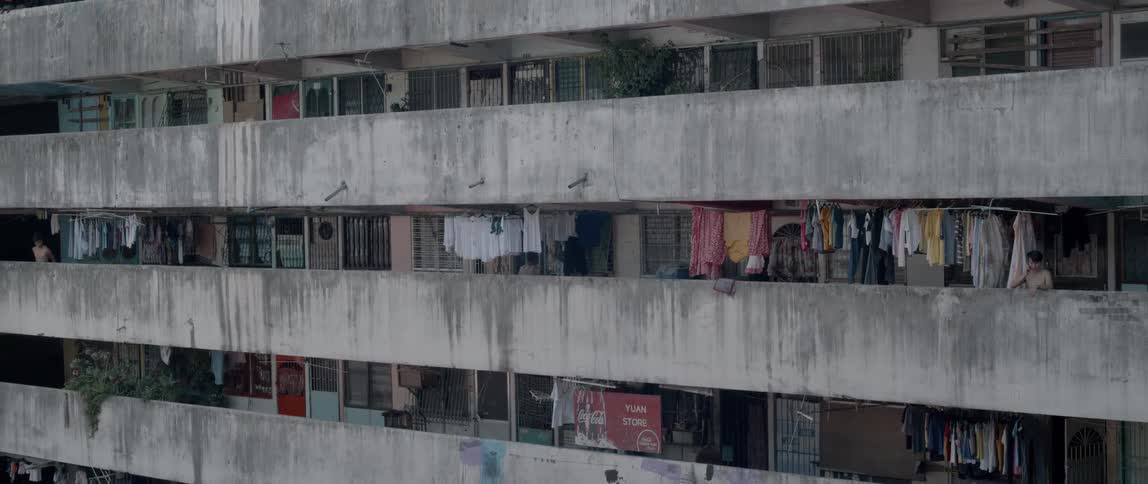 Laundry hangs on apartment balconies