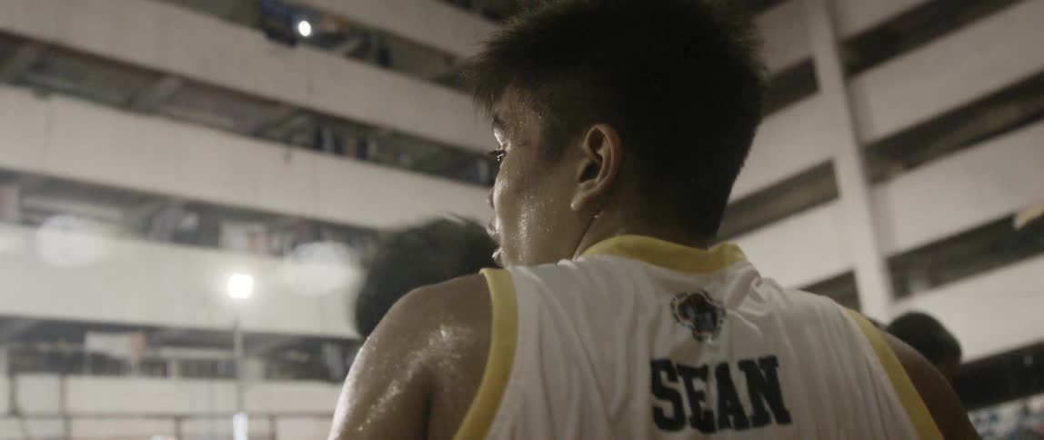 Sweaty basketball player drinks from cup