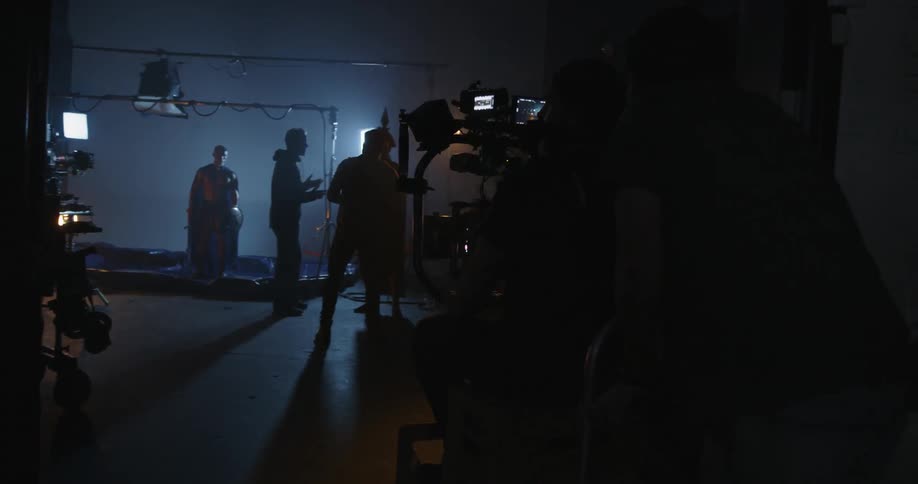 The camera is pushed towards a group of people ahead