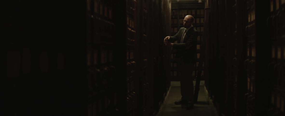 Man searches a card catalog