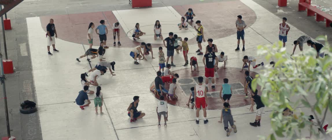 Young kids do physical activities outside