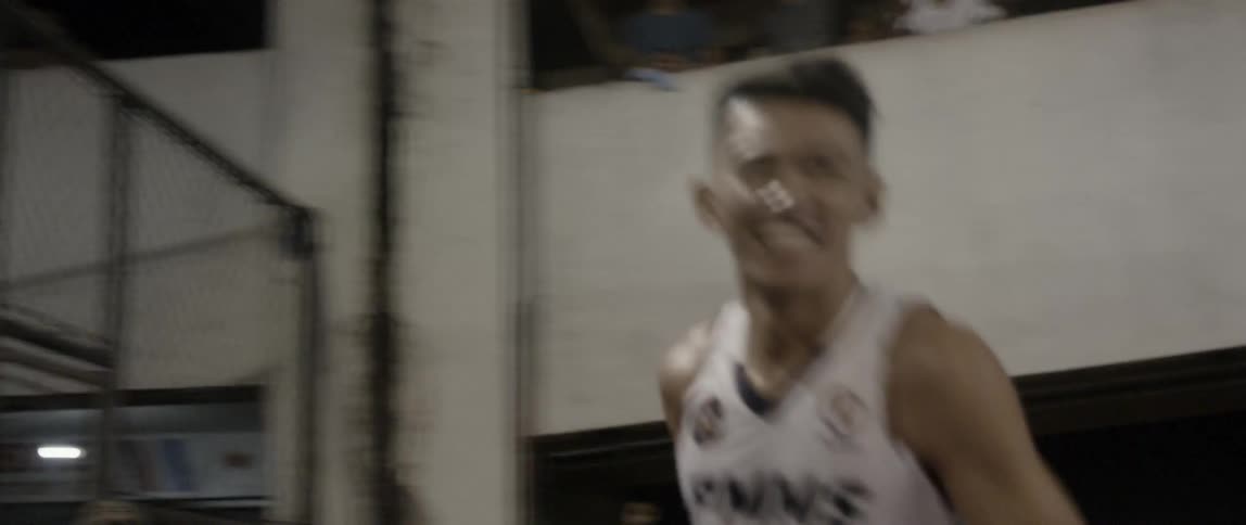 Men play basketball together
