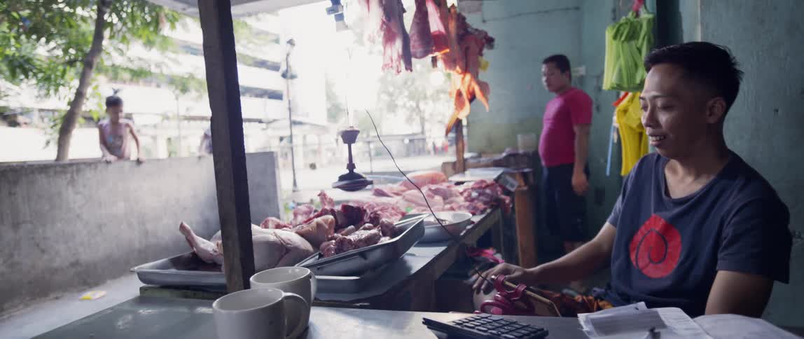 Meat sits on trays at a butcher shop
