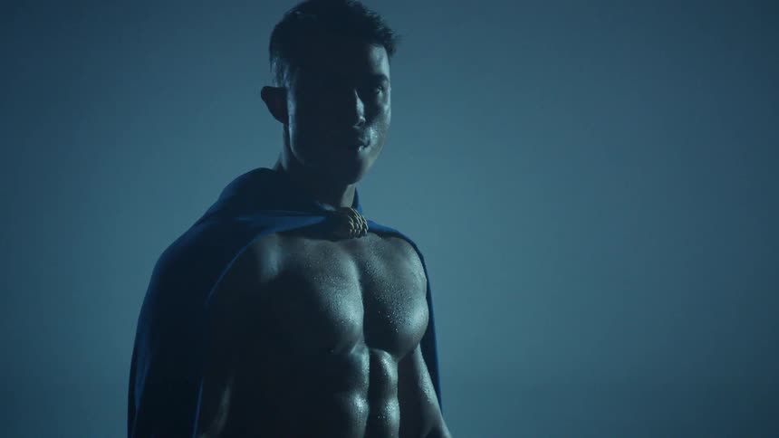 A gladiator stands in the dark