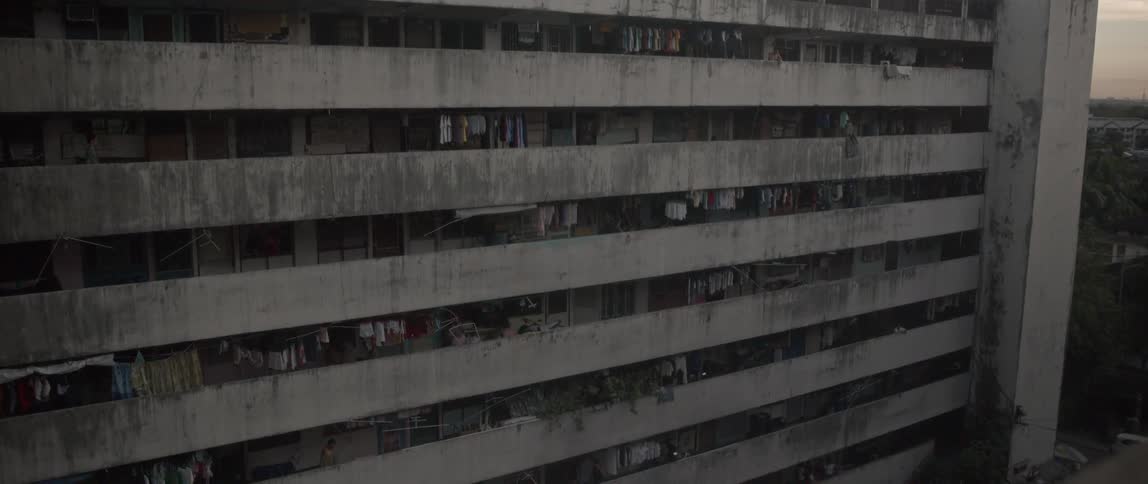 Laundry hangs on apartment balconies