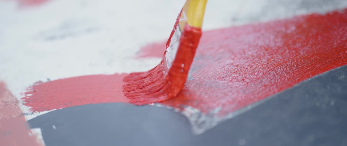 A red line is painted on concrete