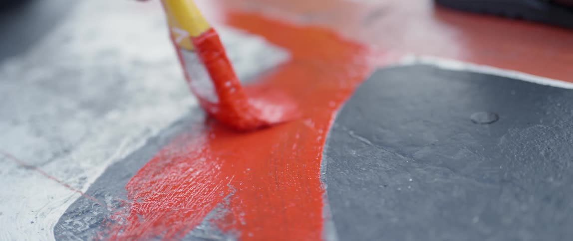 A red line is painted on concrete