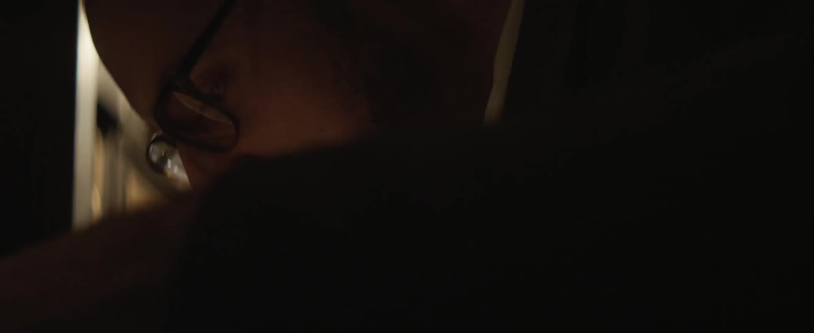 Man wearing glasses talking
