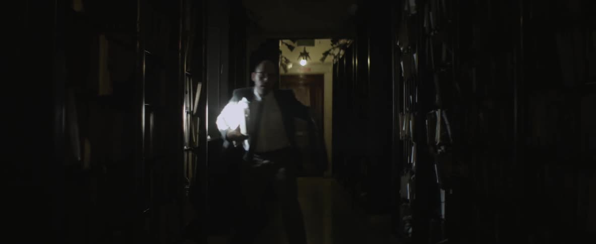 Man grabbing his things and walking forward