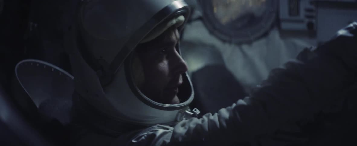 Man in astronaut suit reaching out and talking