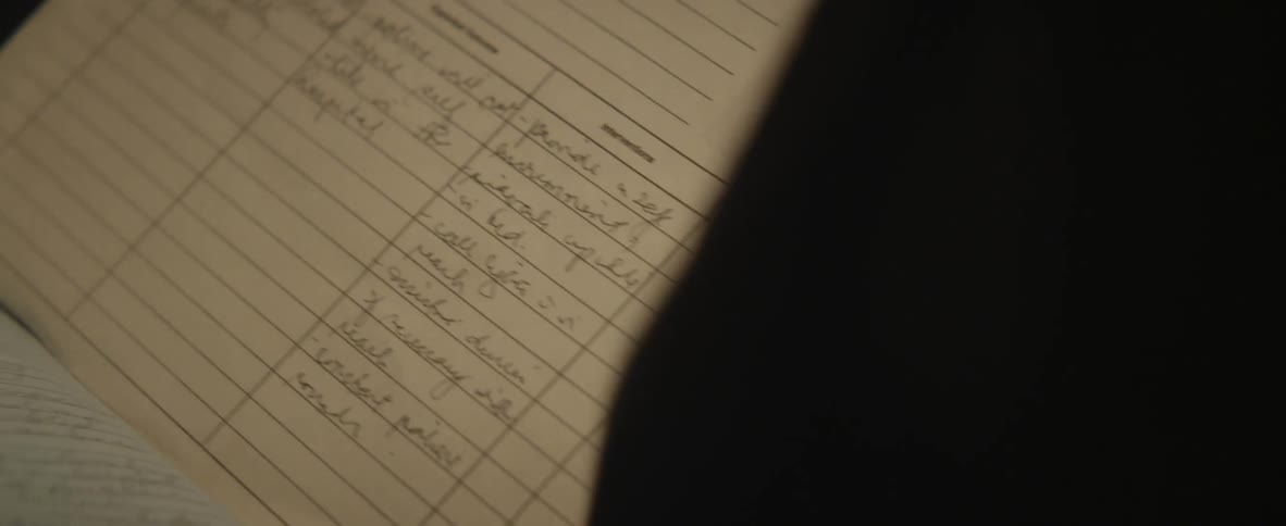 Person grabs and looks into a record keeping book