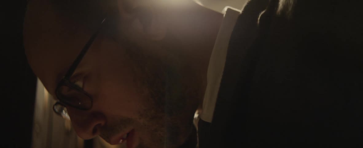 A man feverishly studies something and moves his lips as he reads