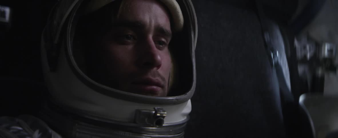 Man wearing helmet looking down