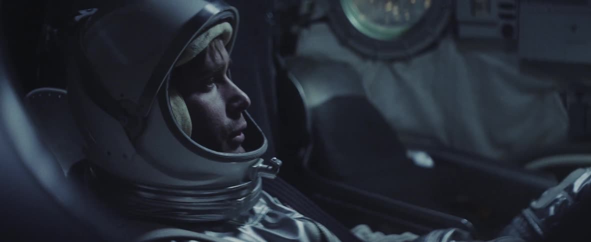 An astronaut flying in a spacecraft
