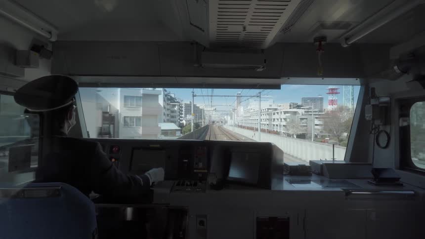 A conductor operates a passenger train