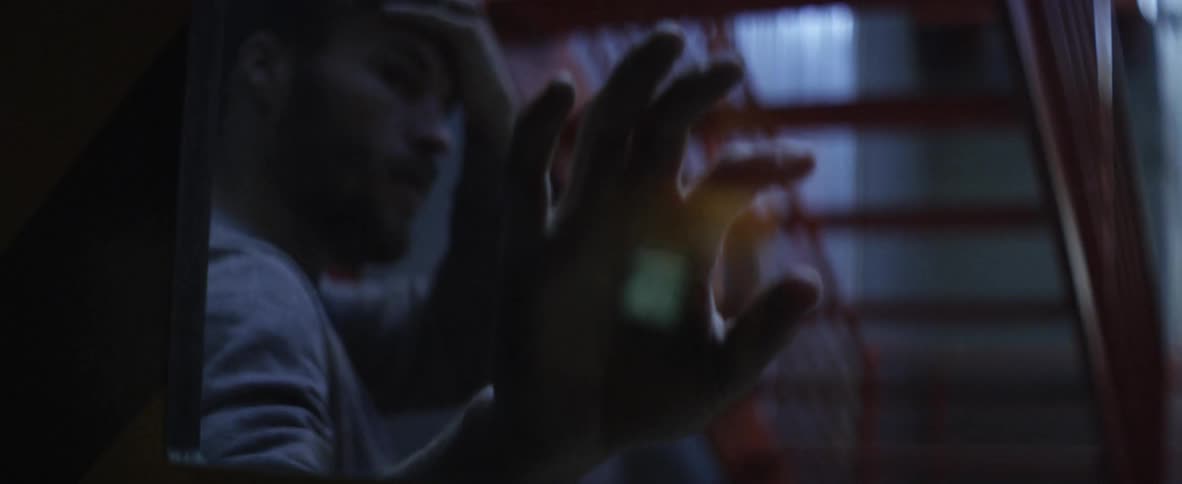 A person touching a window